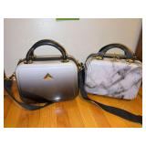 Two TriForce hard sided beauty cases