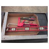 Carpenter square level caulking gun pliers screwdrivers