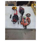 Assorted Tools Including Black and Decker Jig Saw, Tool Shop Sheet Sander, Pittsburgh Measuring Wheel, Work Light, and Measuring Tape