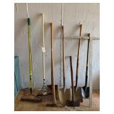 Shovels, rakes, pickaxe, axe, and t-square