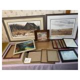 Lot of picture frames and pictures