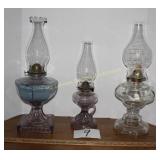 2 Purple Hue Oil Lamps and One Clear