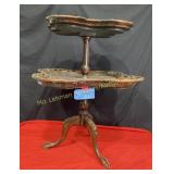 two teir dark ornate table  34 " tall 25 by w and