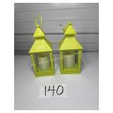 2 neon green battery operated lit candle lanterns