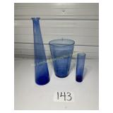 3 pieces of blue glass vases different sizes and