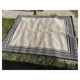 Black and grey outdoor rug,  120" x 92"