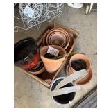Wood crate full of misc. flower pots and baskets