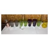 box full of plastic multi colored and glass vases