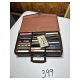 Cassette Case filled with various artist cassettes