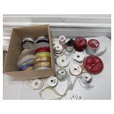 Box of various colors, patterns of ribbon.
