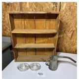 wood crate shelf with oil can and glass chicken