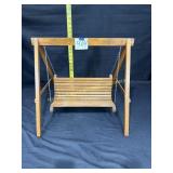 a small wooden bench swing for stuffed animals