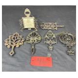 2 Cast Iron trivets, 1- Iron Art