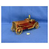 VINTAGE TIN TYPE CAR WITH CAST IRON DRIVER