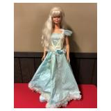 36" BLONDE DOLL WITH BLUE DRESS ON ROTATING STAND