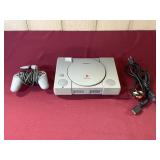 SONY PLAYSTATION WITH POWERCORD & CONTROLLER