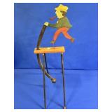 SWINGING FOLK ART WOOD CUTTER APPROX 27"