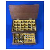 BROWN WOODEN JEWELRY BOX WITH LOTS OF RINGS AND