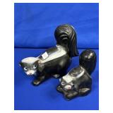 (PAIR) CEMENT SKUNKS APPROX 8.5" & 11.5"