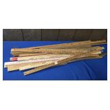 STACK OF WOODEN ADVERTISING YARD STICKS