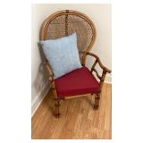 Two wooden chairs with cushions and pillows