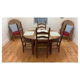 Oval dining room table with four chairs
