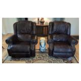Two dark brown recliners with elephant figurine