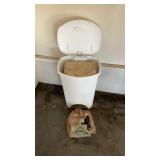 Trashcan, full of rags and bag of spray paint