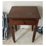 Two wood tables with drawers and contents