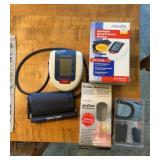 Blood pressure monitor, and pulse oximeter