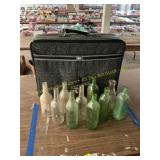 Glass bottles and suitcase