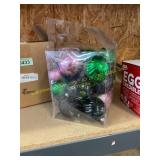 Pink, green, and black Christmas ornaments