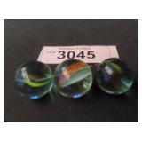 Three vintage cat eye marbles