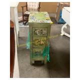 Painted side cabinet with floral decor