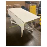 White wooden dinning table with drop leaves
