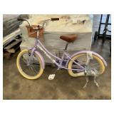 Purple kids bike with basket