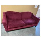 Upholstered red sofa
