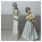 (2) Girl Holding Animals Figurines- Swan/Puppy