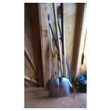 Snow shovel, leaf rake and brooms