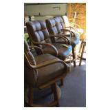 Five Leather Swivel Bar Stools. Seat height 27".