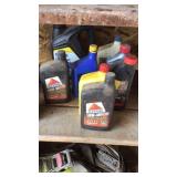 (8) ASSORTED MOTOR OL JUGS & A FUEL FILTER