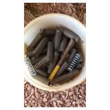 BUCKET OF SPRINGS AND SPOOL OF COPPER WIRE