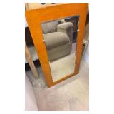 BEVELED EDGE MIRROR ON WOOD BACKGROUND