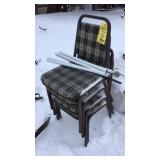 (4) STACKABLE CHAIRS & METAL POLES W/ELASTIC BAND