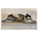 SET OF UNMARKED SILVER STYLE SPURS