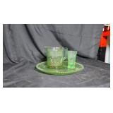 Green glass plates, cup and pitcher