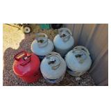 4 empty propane tanks, 5gal, 1 empty helium tank