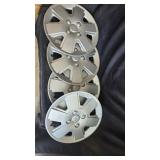 NIB set of 4 ford hubcaps 15"