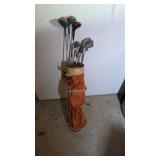 Golf clubs in bag, Titleist woods, Dunlop irons