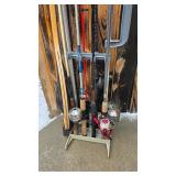 8 fishing poles, fishing pole stand, and net